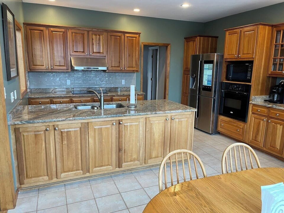 Large eat In kitchen with seating for 6.  Kitchen is fully stocked for you to make all your meals.  Includes coffee maker (K-cup or regular) and there is even kids dishes.  