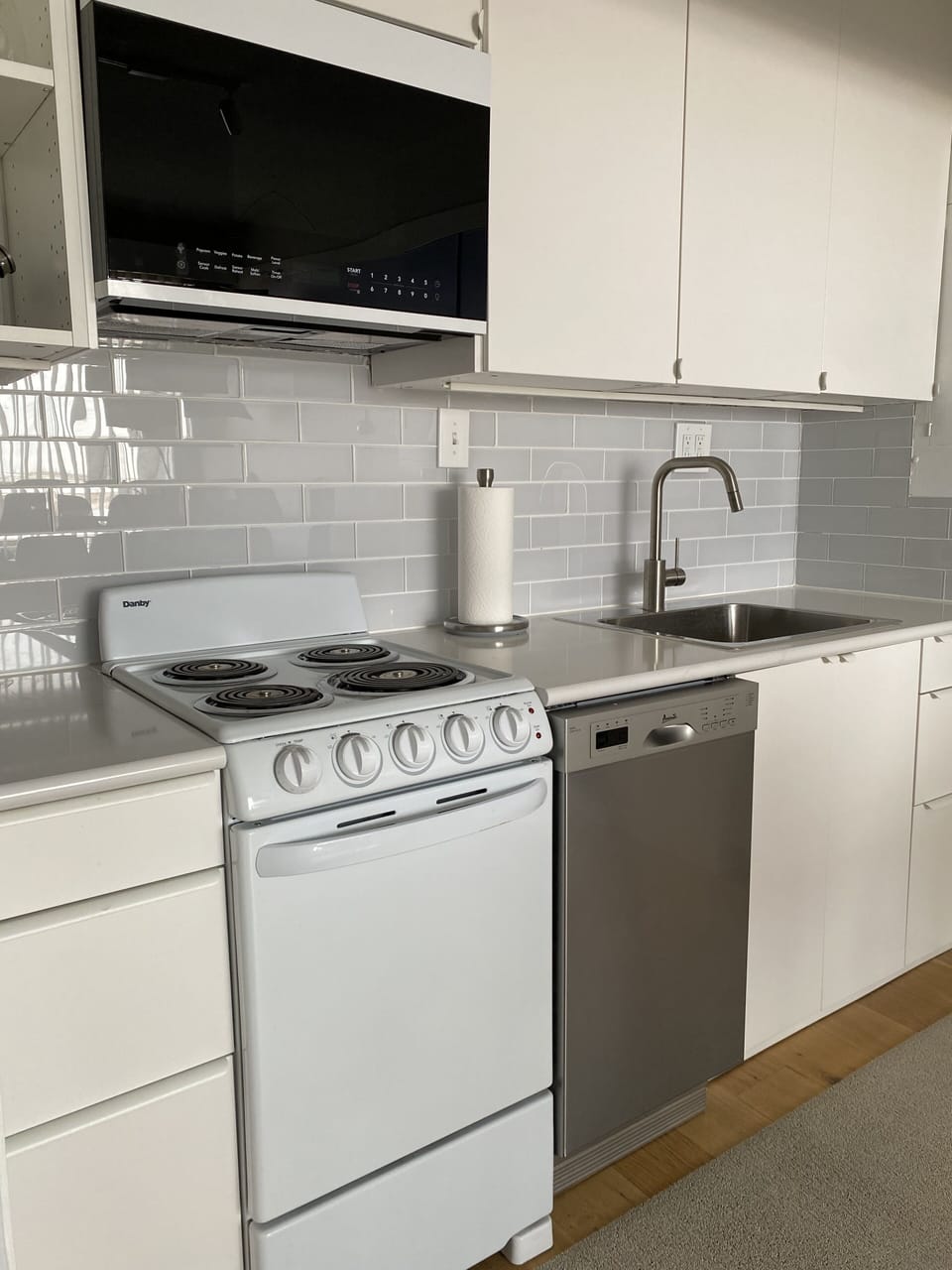 Stove, oven, microwave, frig, freezer, coffee maker, toaster, plates & glasses. 