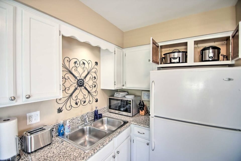 The kitchen is fully stocked with all the modern appliances, dishwasher, refrigerator with ice maker, stainless steel microwave, toaster, slow cooker, rice cooker, air fryer and blender.