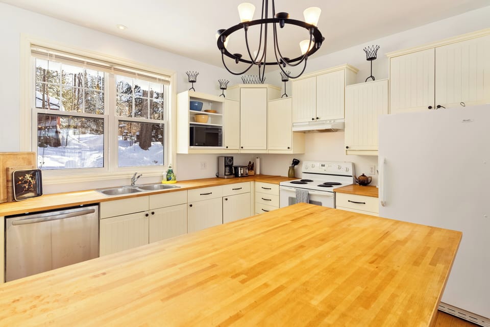The kitchen comes stocked with all appliances, cooking utensils and condiments.