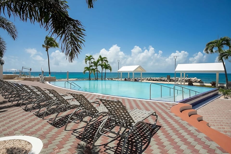 Stretch out on sun loungers steps from the water.