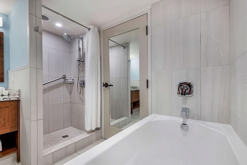 Refresh after the beach with a soothing tub and rain shower.