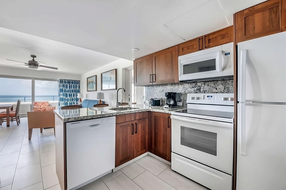 Cook with ease in a full kitchen with granite counters.