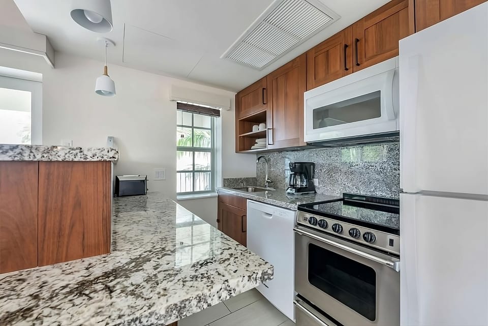 Cook with ease on granite counters and full appliances.