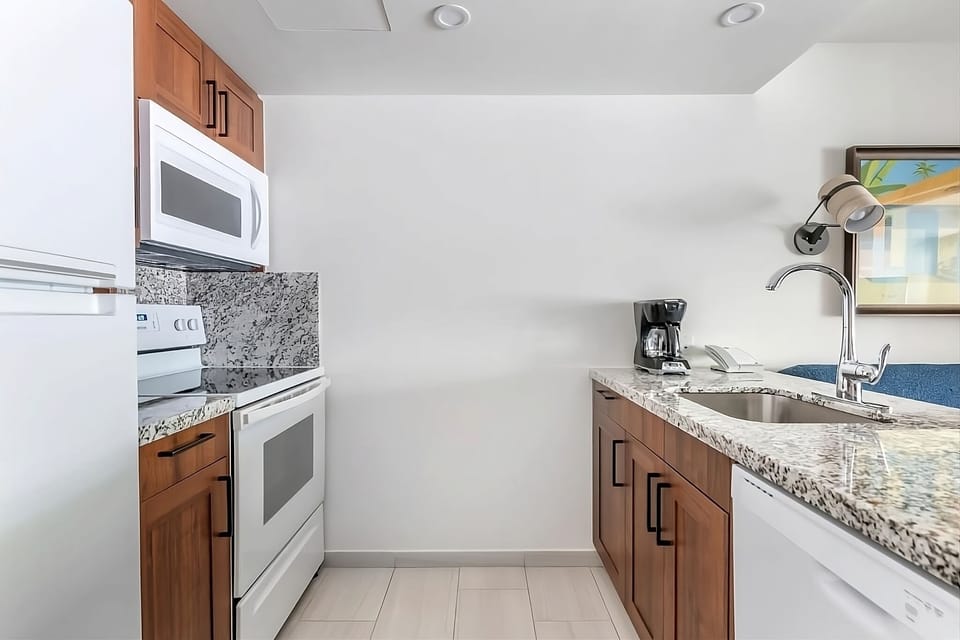 Whip up easy meals in the polished kitchen with granite counters.