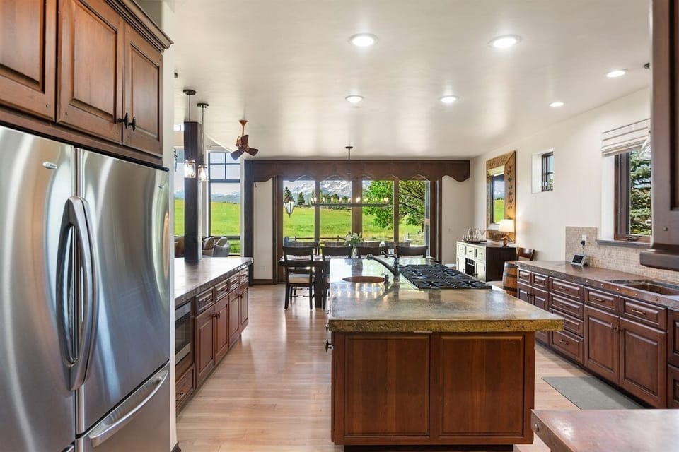 Gourmet kitchen with 8-burner gas range and updated appliances
