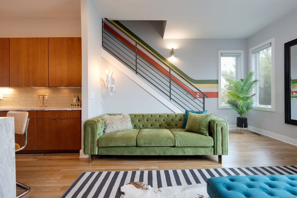 2nd Floor: Eccentrically designed living space featuring designer furnishings, retro arcade games, and a flat-screen Smart TV for entertainment.