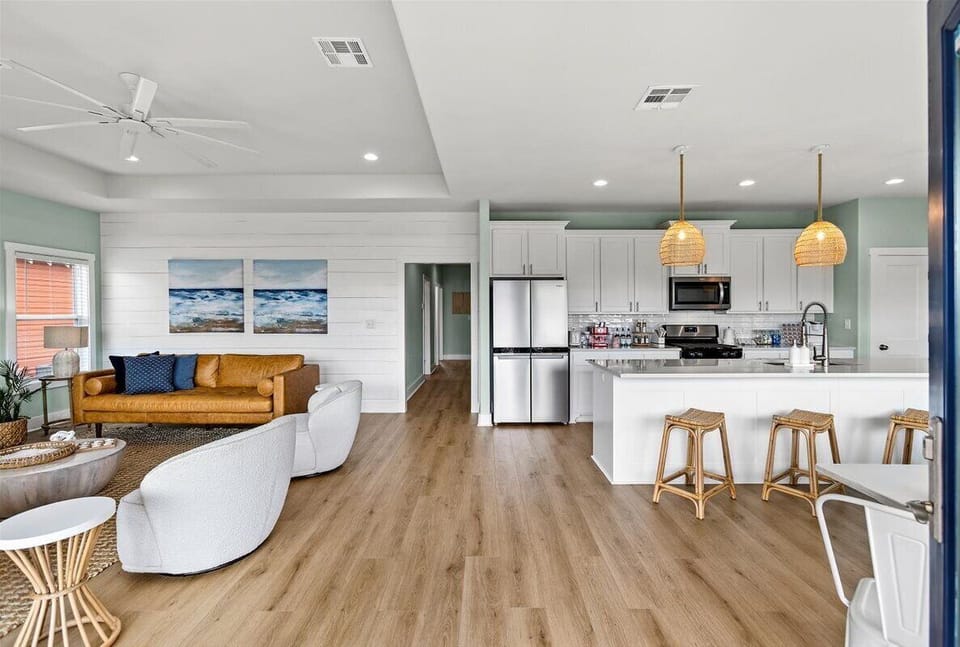 Open concept living, kitchen and dining room with oversized island