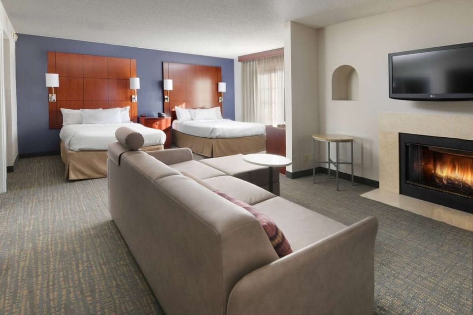 Unwind by the fireplace in a spacious double-bed suite.