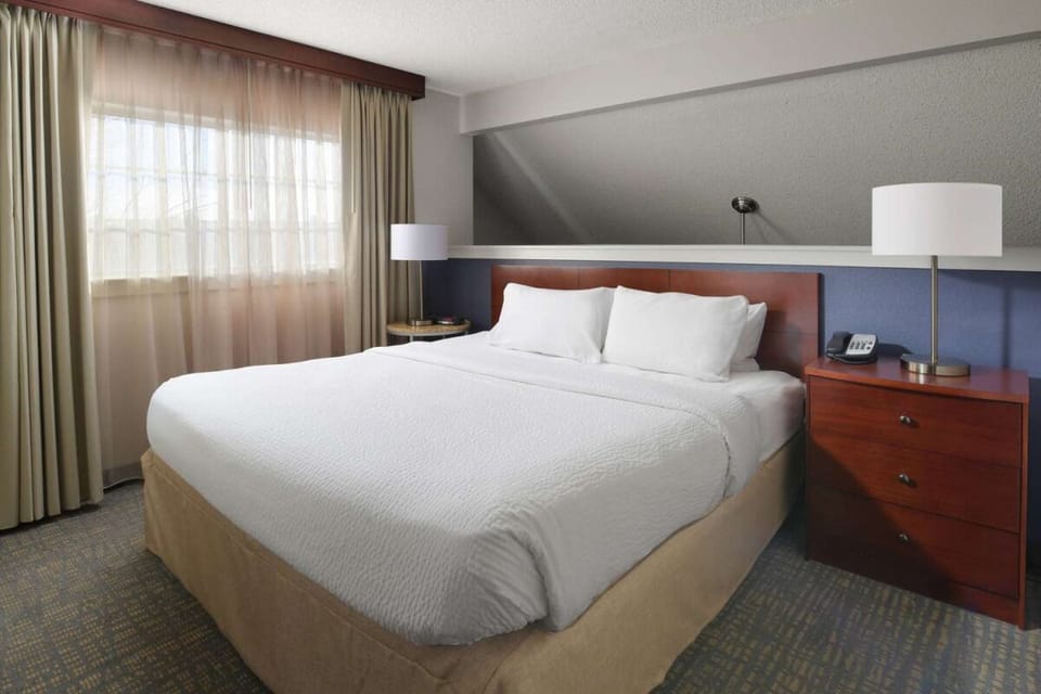 Sink into crisp linens after a day of exploring.