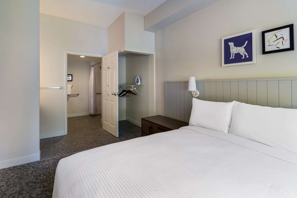 Unwind on crisp linens with easy ensuite access nearby.