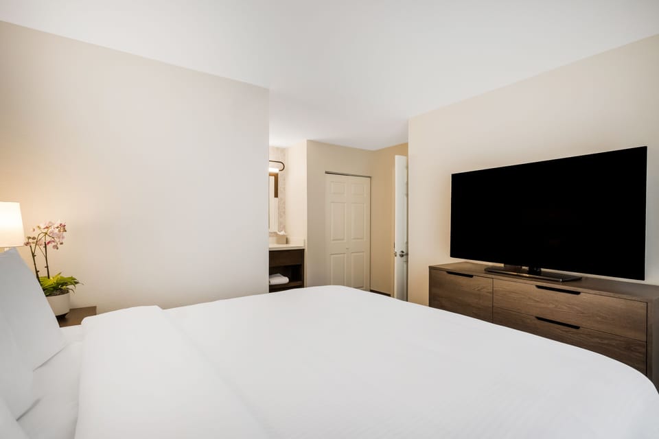 Sink into plush bedding and enjoy your favorite shows.