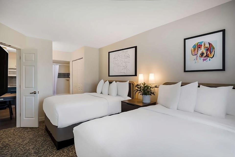 Stretch out on spotless bedding in a calm, quiet room.