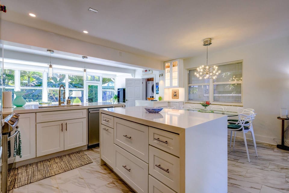 The updated kitchen offers a beautiful view, making meal preparation a pleasure from start to finish.