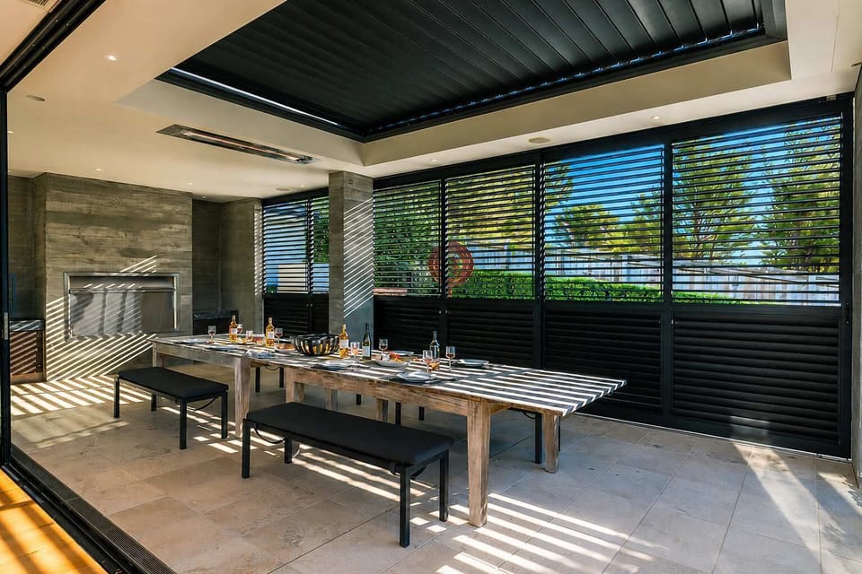Outdoor entertaining area with sliding doors and heaters for the cooler months