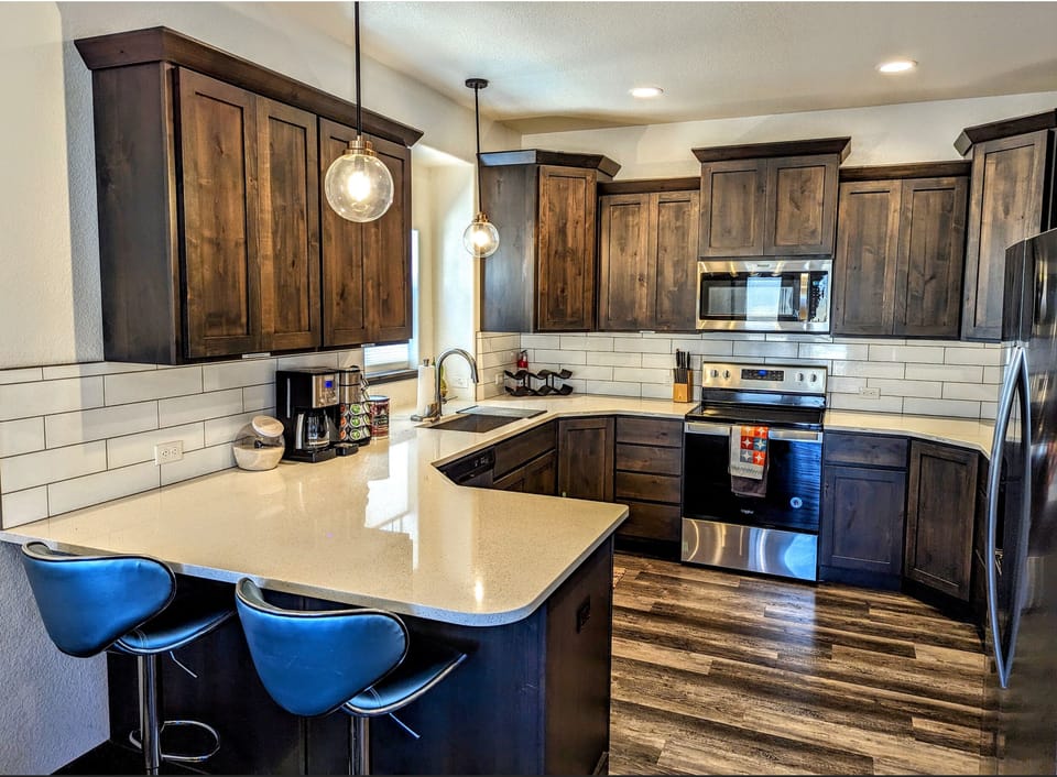 Large open stocked kitchen, Coffee pot, toaster, blender, and gadgets
