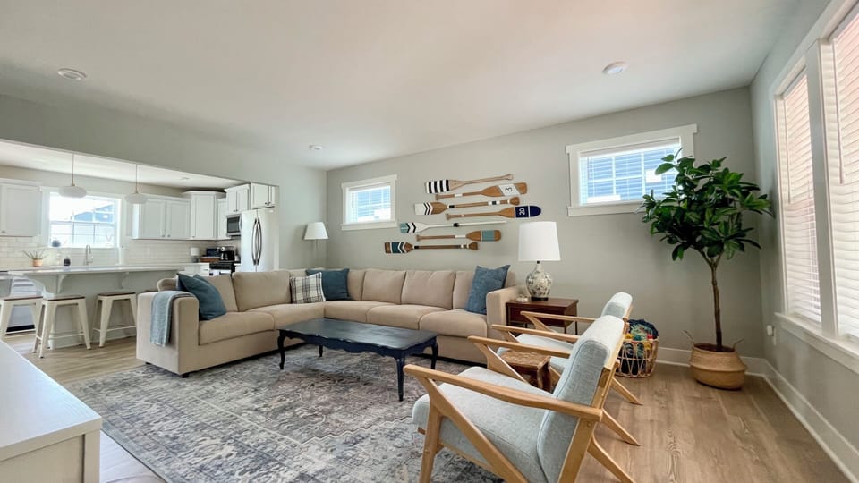 Cozy living room with plenty of seating. Open to the kitchen and dining area. 