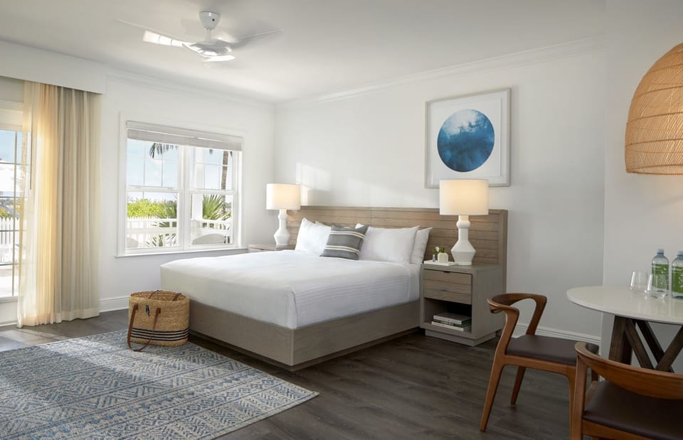 Unwind in a sunlit king bedroom with breezy coastal views.