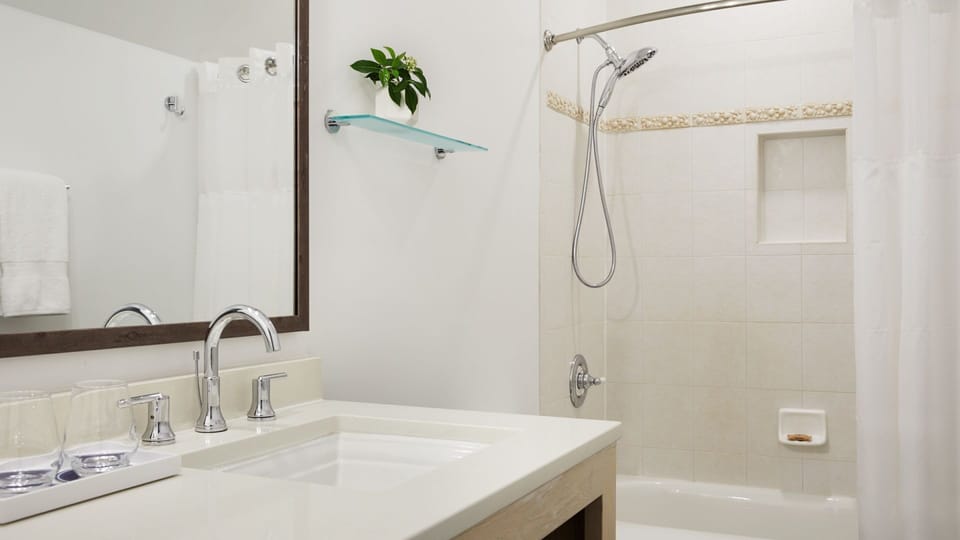 Relax with a soothing shower and crisp, spa-like bathroom finishes.