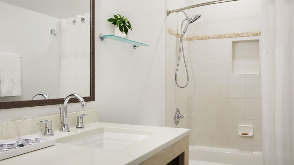 Relax with a soothing shower and crisp, spa-like bathroom finishes.