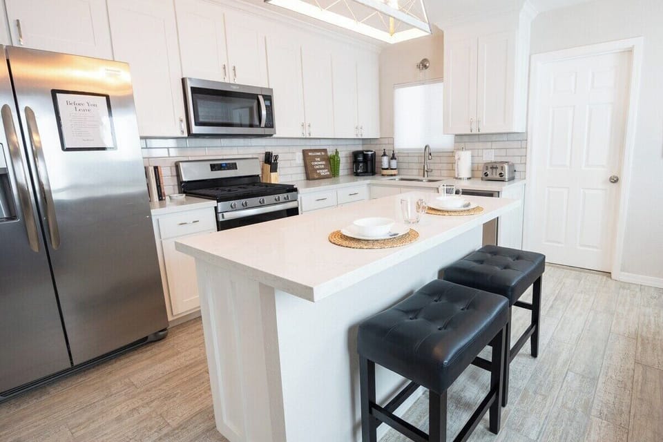 Kitchen with island seating and open concept with all the essentials 