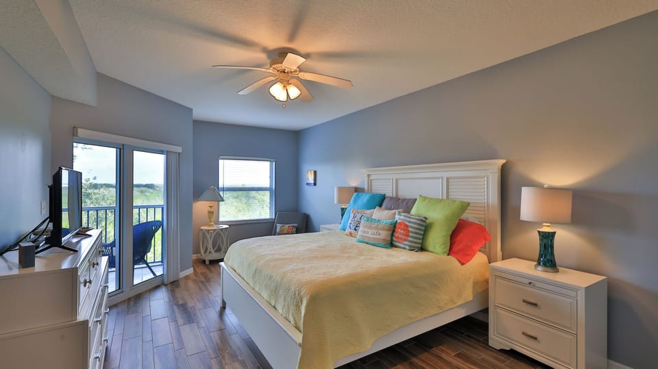 After a day in the sun, relax in the master suite with balcony access!