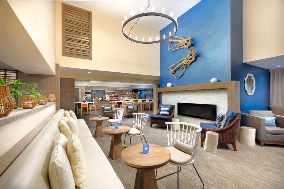 Gather with friends in an airy lounge with cozy seating.