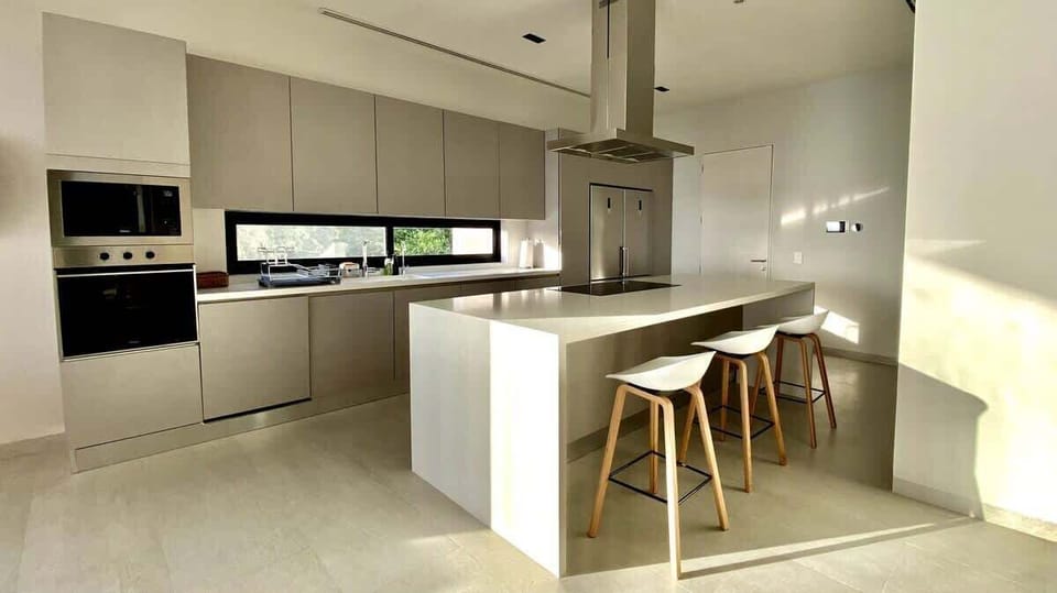 Create culinary masterpieces in the fully equipped, state-of-the-art kitchen, featuring top-of-the-line appliances and beautiful design.