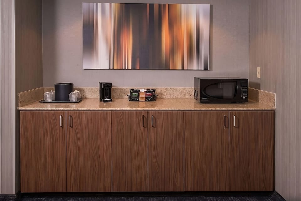 Grab snacks anytime with microwave, coffee, and mini refreshment bar.