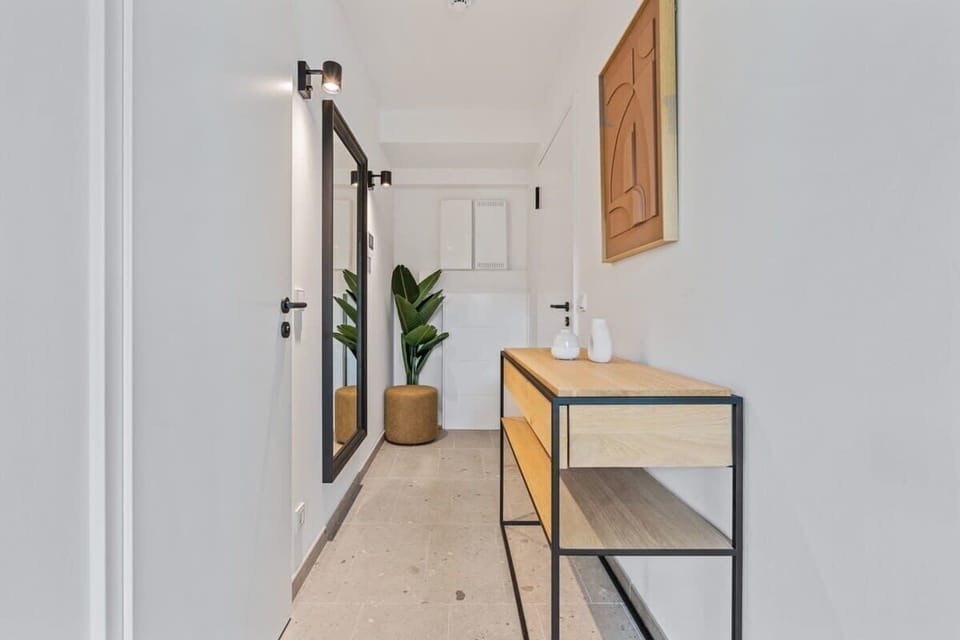 Welcome to your serene escape: a bright entryway that sets the tone for a relaxing stay with modern comforts. Direct bookings: www.arcaproperties.lu