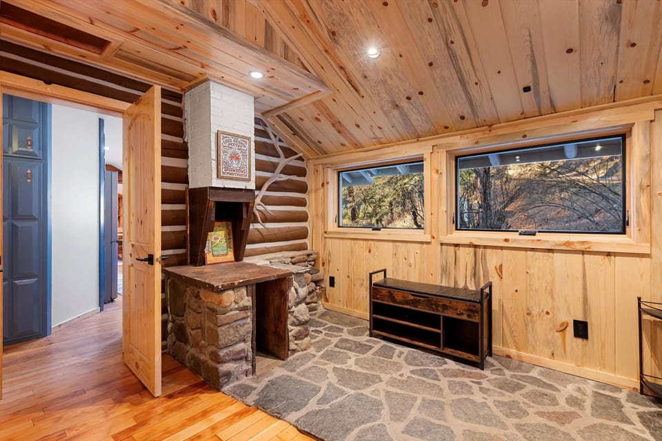 Back bedroom. Interior entrance off kitchen, and exterior entrance. Elk rack for hanging clothes. 