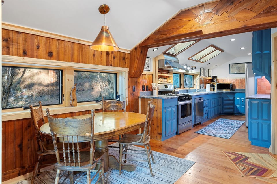 The open-concept living space seamlessly blends the fully renovated kitchen with the dining area.