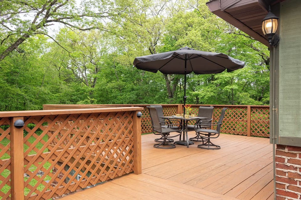 Your large upper level deck provides a lucious backdrop of amazing nature