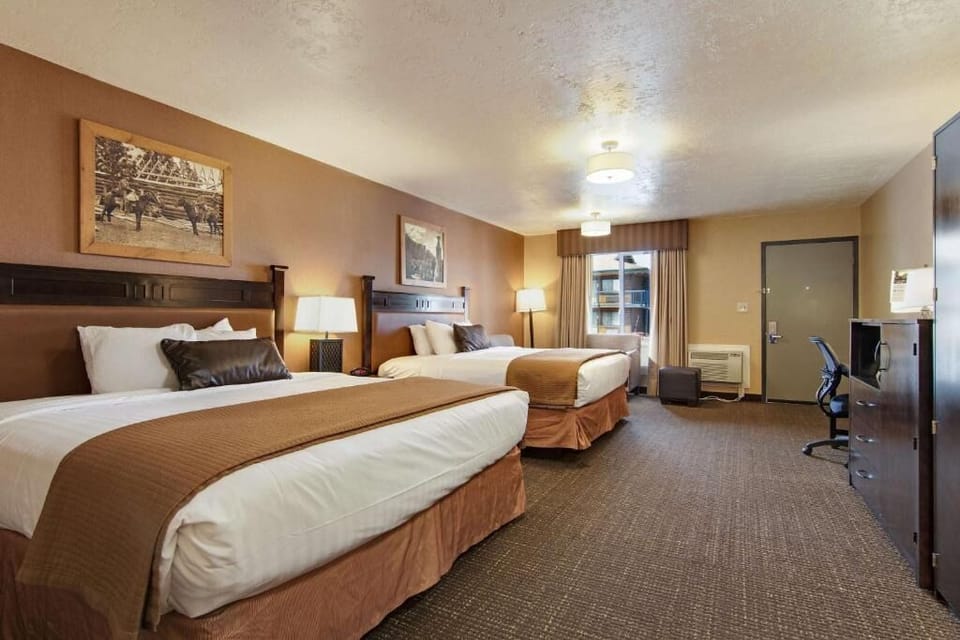 Enjoy a quiet night with two beds and soft, layered linens.