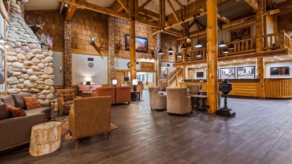 Gather in the grand lodge lobby with warm stone fireplace vibes.