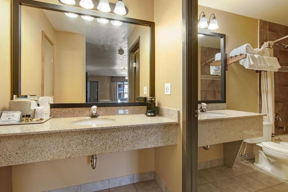 Refresh effortlessly with a spacious vanity and bright mirror lighting.