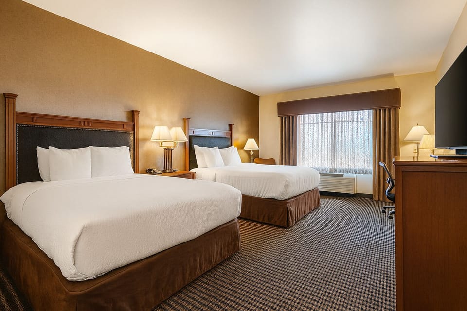 Settle into two plush beds for a restorative night’s sleep.