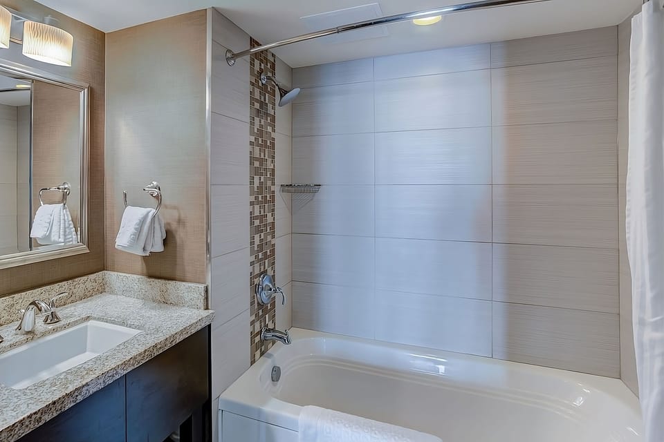 Refresh after the beach with a bright tub-shower combo.