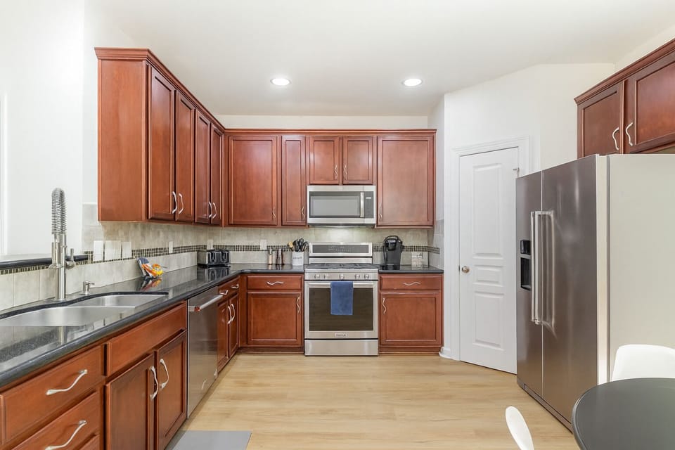 Well stocked large kitchen with full sized pantry and eat in seating.