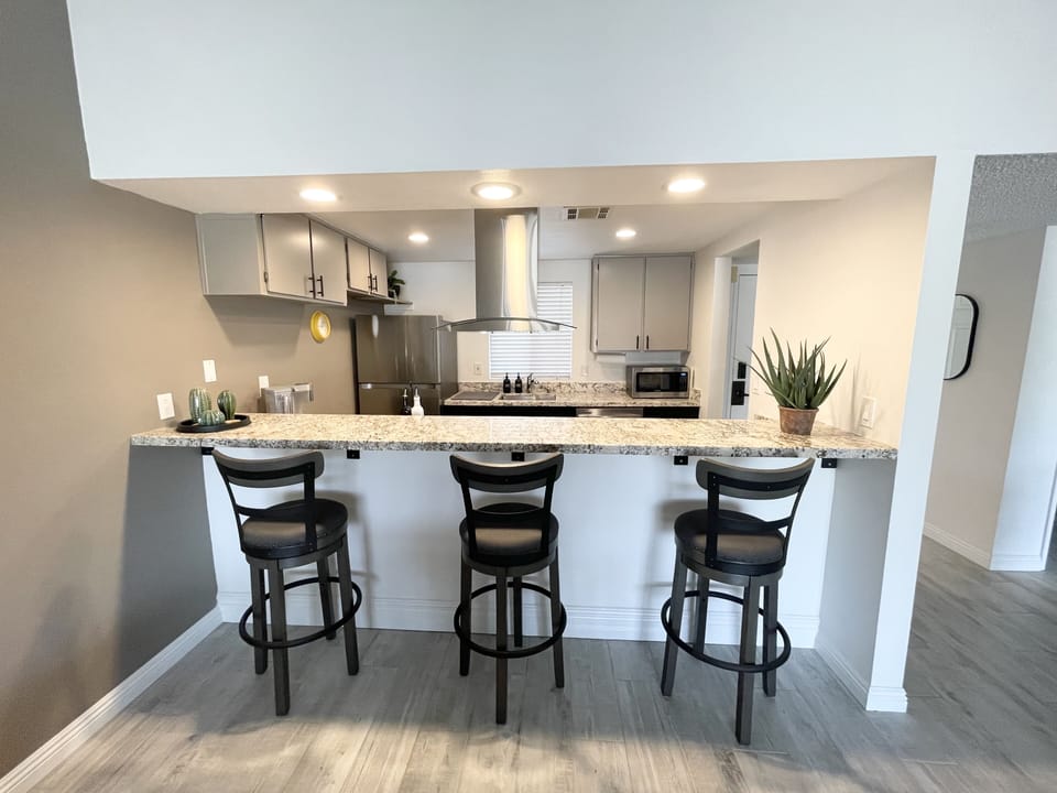 Kitchen and bar. Open floor plan. 