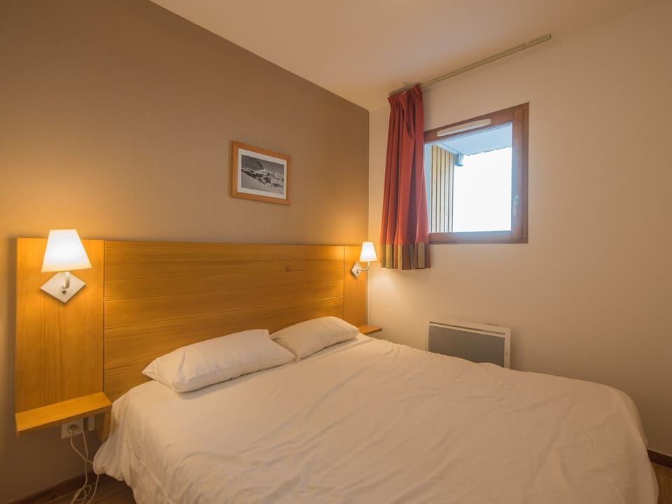 Experience a peaceful night's sleep in our tranquil and cosy bedroom.
