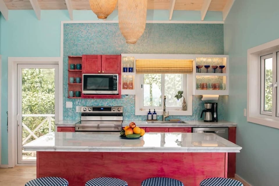 The cheerful kitchen is stocked with all you need whether preparing meal, or mixing up a batch of rum punch!