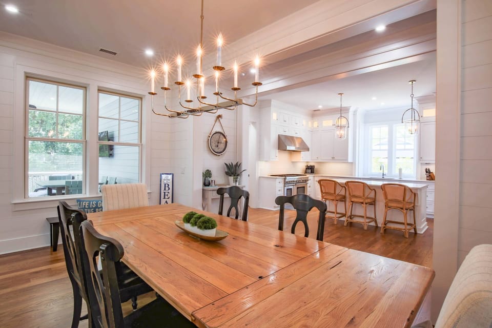 The dining table seats 8 with additional seating at the island as well as the outdoor dining table.