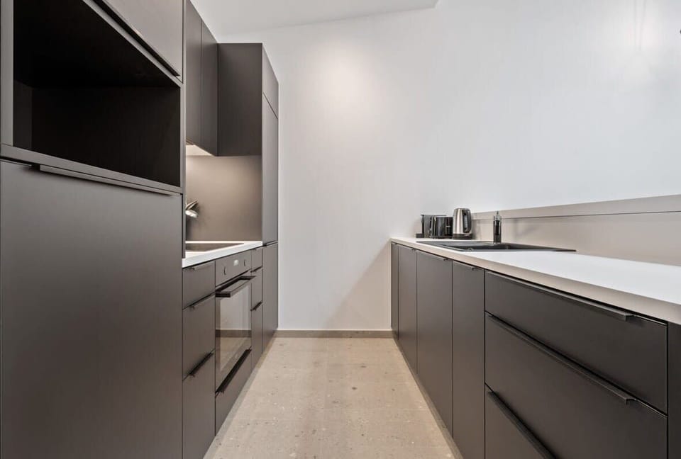 Sleek and functional – a kitchen space where style meets convenience.