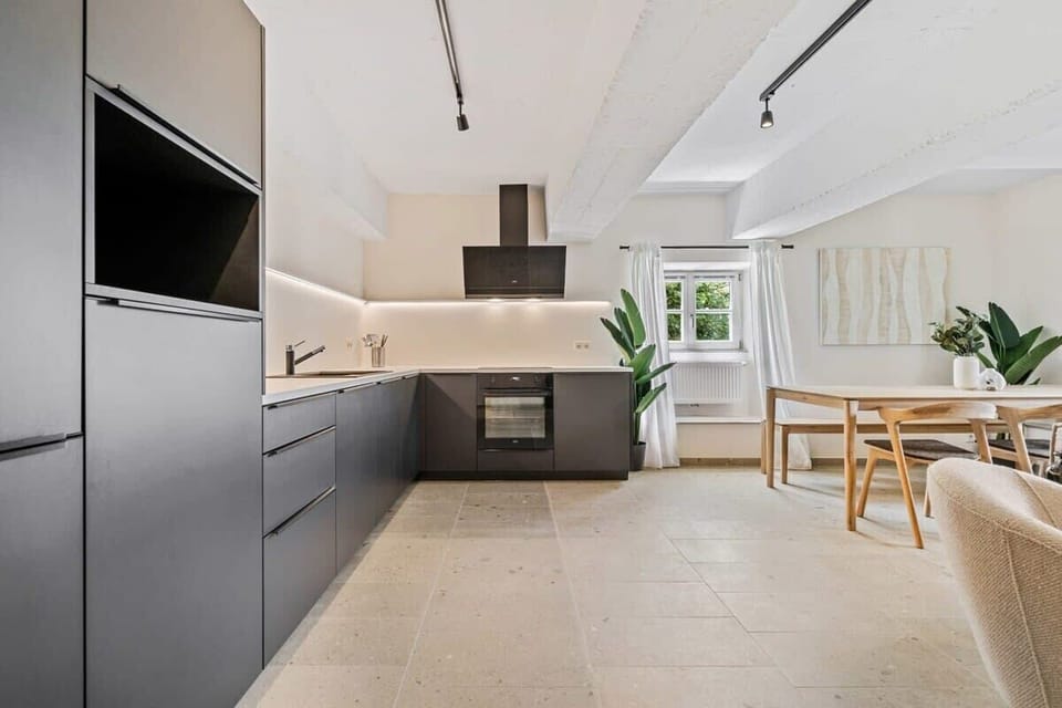 Savor home-cooked meals in our contemporary kitchen. Direct bookings: www.arcaproperties.lu