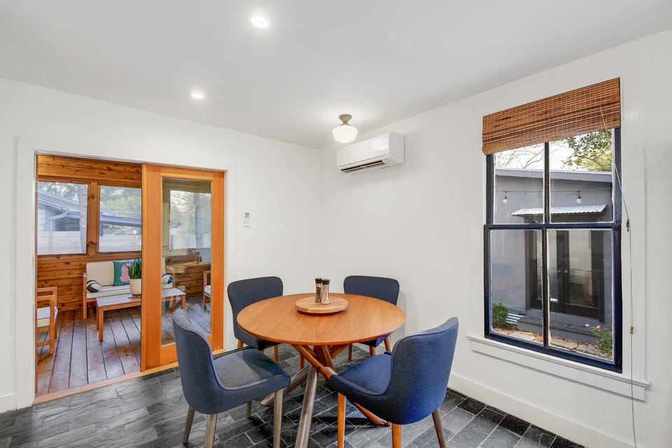 Step into the outdoor oasis w/ a screened-in patio, attached to the kitchen.