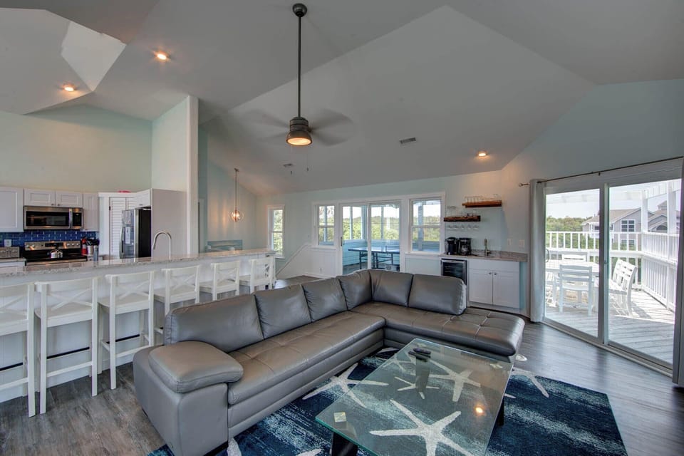 Living Area - Large windows with natural light make this living space an entertainer's dream.