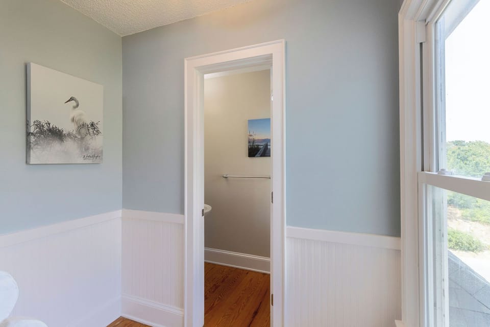 Powder Room - Located just off the stairs, this bright powder room is great for guest.