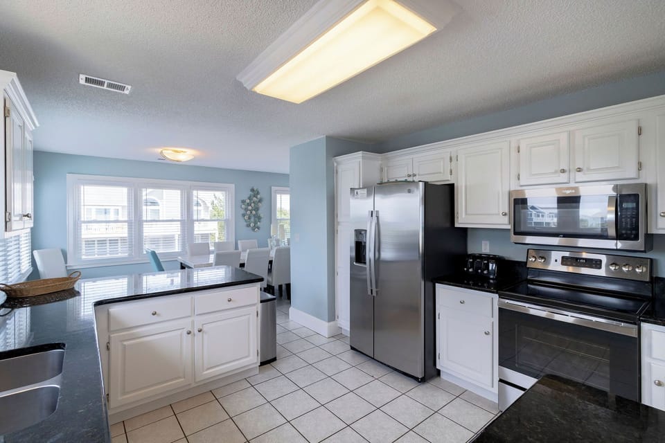 Kitchen - Stainless appliances, beautiful granite and bright windows this kitchen has it all.