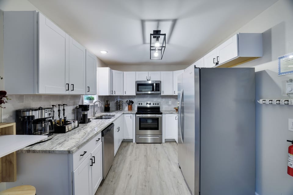 Fully equipped kitchen with modern appliances and ample counter space.